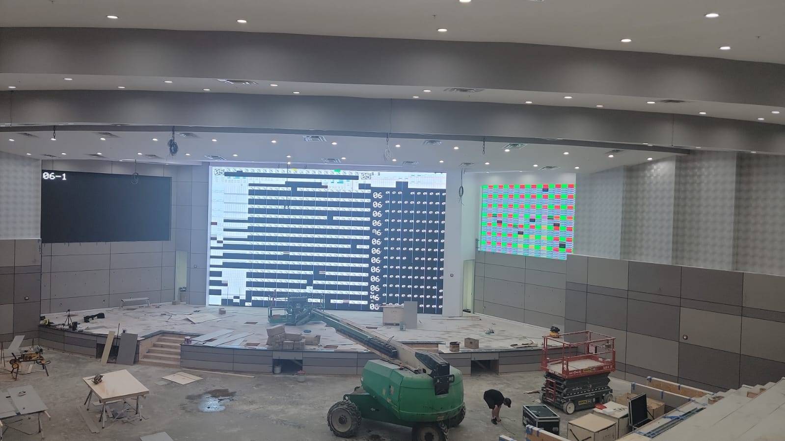 Church sanctuary with three LED walls showing mapping and test content during commissioning