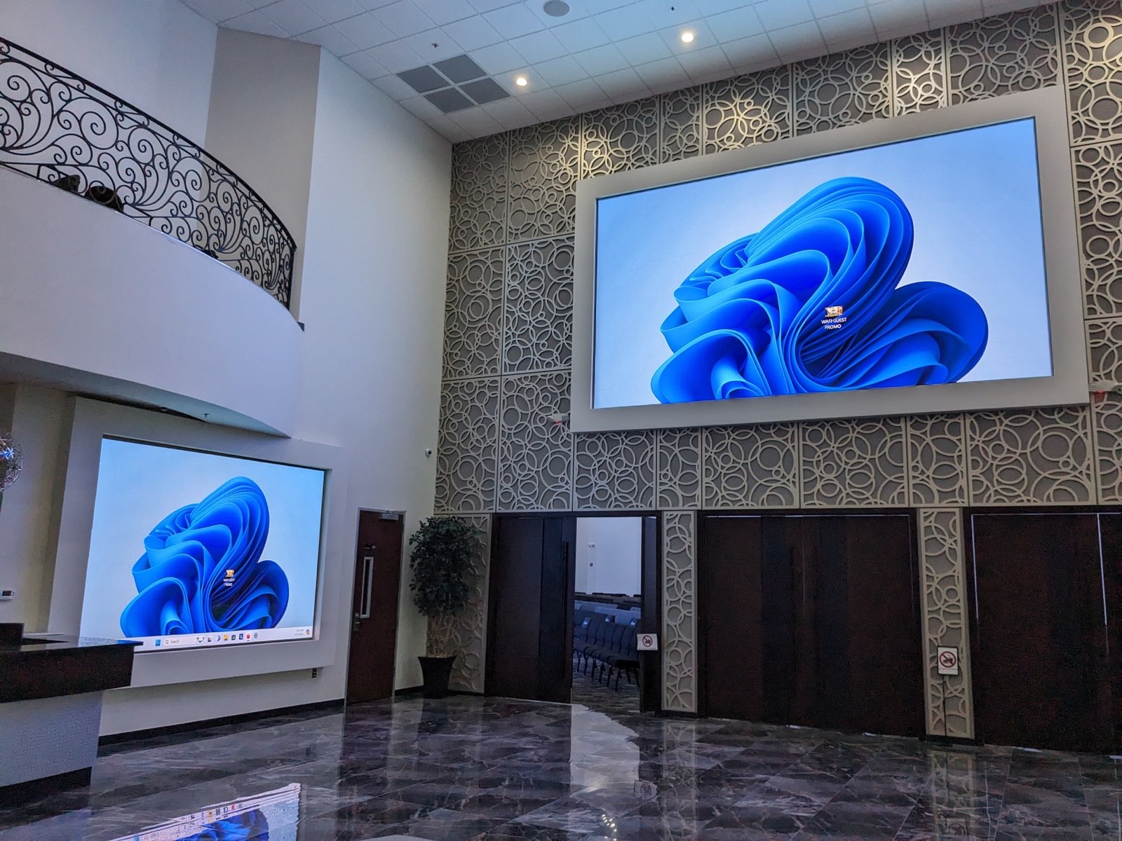 Grand lobby with two wall-mounted LED displays