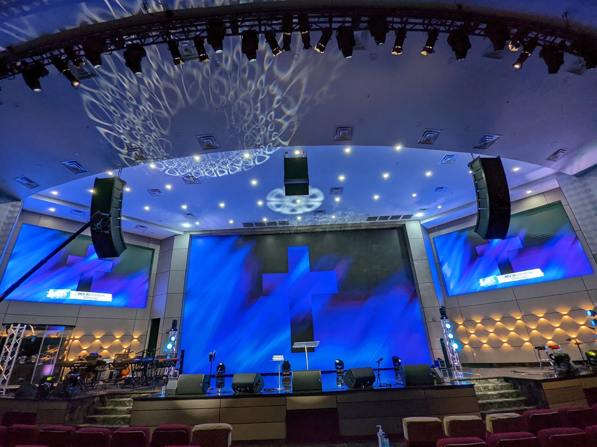Worship sanctuary with a triple LED video wall system displaying cross graphics